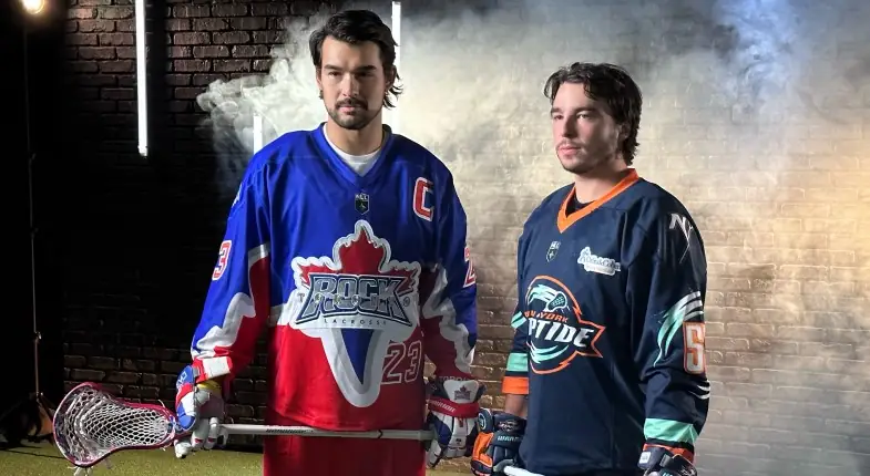 Two lacrosse players pose for photo