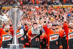 Buffalo Bandits players celebrating championship win in front of cheering crowd